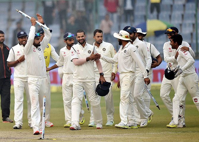 The Indian team celebrates the win over South Africa during final day of the fourth Test at Feroz Shah Kotla.