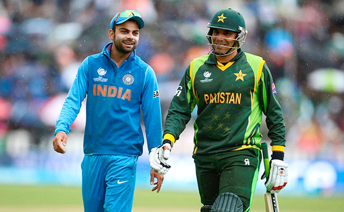 India's Virat Kohli with Pakistan's Misbah-ul Haq 