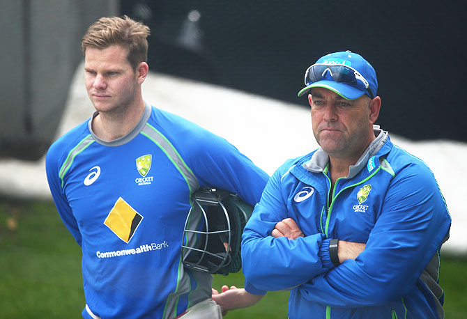 Australia captain Steve Smith and coach Darren Lehmann look on during a nets session at Blundstone Arena in Hobart