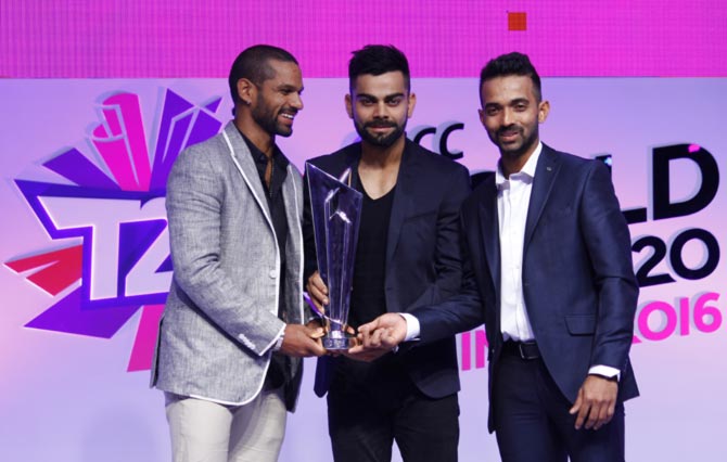 (Left to right) Shikhar Dhawan, Virat Kohli and Ajinkya Rahane with the ICC World T20 Trophy in Mumbai