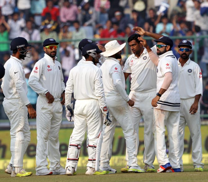 India's Ravichandran Ashwin celebrates taking a wicket 