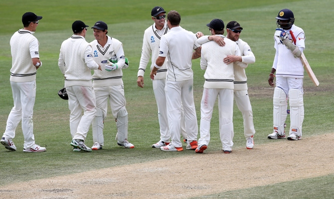 The New Zealand team congratulate each other after defeating Sri Lanka in the first Test in Dunedin 