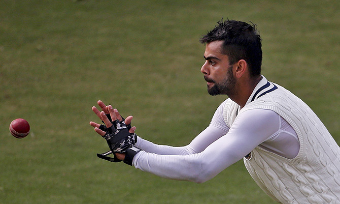 India's Test captain Virat Kohli prepares to catch the ball during a practice session 