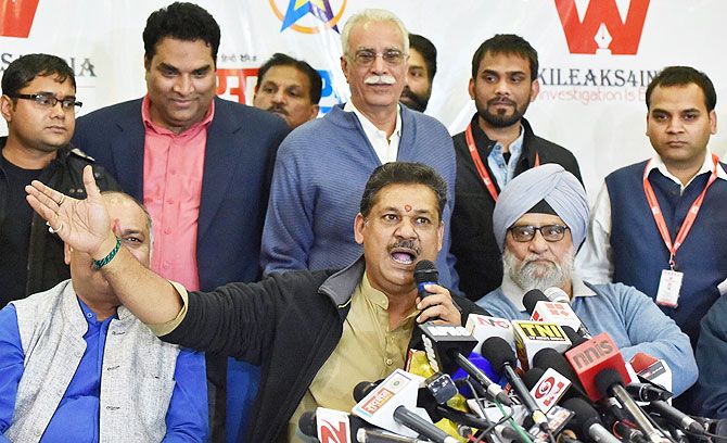 BJP MP and former cricketer Kirti Azad (centre) with veteran cricketer Bishan Singh Bedi during a press conference regarding DDCA in New Delhi on Sunday