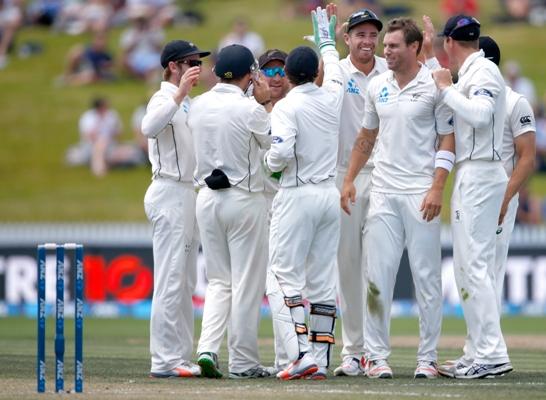 Doug Bracewell of New Zealand celebrates his wicket of Dimuth Karunaratne of Sri Lanka 