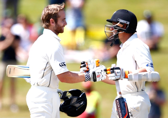 Kane Williamson of New Zealand is congratulated by BJ Watling 
