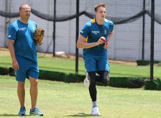 Charl Langerveldt watches Morne Morkel bowl during the South African training session in Durban