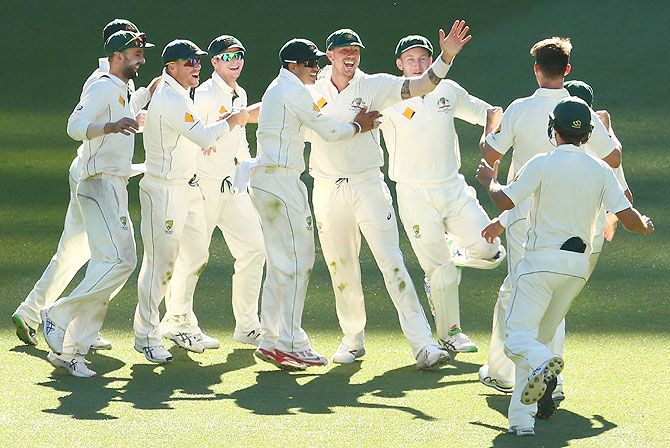 Australia's James Pattinson is congratulated by his teammates after taking a catch to dismiss West Indies' Jerome Taylor to win the match on Day 4 of the Second Test match at the Melbourne Cricket Ground in Melbourne on Tuesday