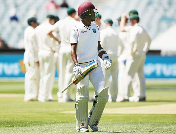 West Indies' Kraigg Brathwaite walks off after being dismissed by Australia's Nathan Lyon