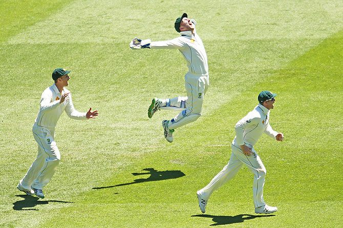 Australia's wicketkeeper Peter Nevill celebrates after taking a catch to dismiss West Indies' Marlon Samuels during Day 4 of the second Test at the Melbourne Cricket Ground on Tuesday