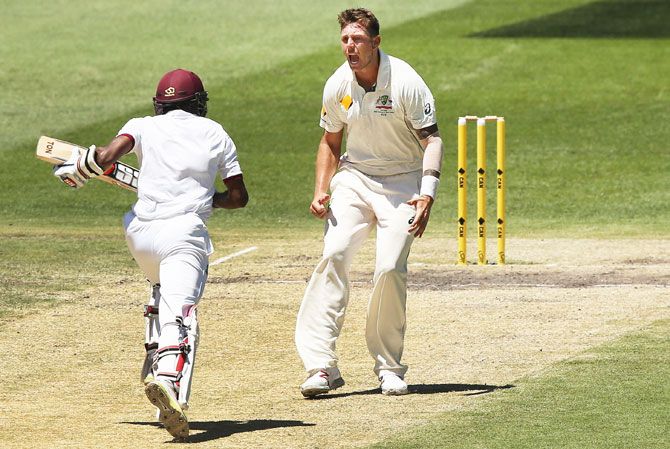 Australia's James Pattinson tries to intimidate West Indies' opener Rajendra Chandrika as he scampers for a run