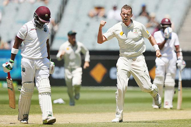 Australia's Peter Siddle celebrates after dismssing West Indies' Darren Bravo