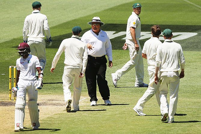 The umpire speaks to Australia captain Steve Smith on Day 4 of the second Test match at Melbourne Cricket Ground in Melbourne on Tuesday.