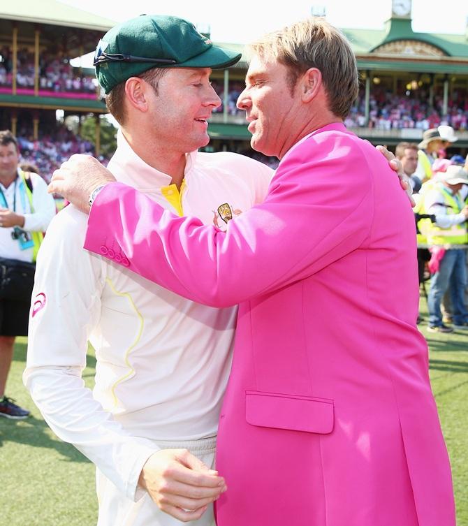 Michael Clarke of Australia is congratulated by Shane Warne