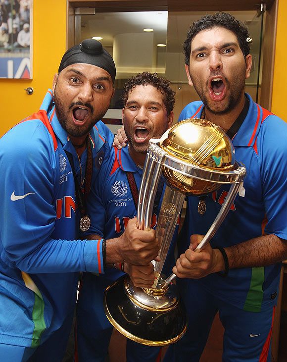 Yuvraj Singh, Sachin Tendulkar and Sachin Tendulkar celebrate after winning the World Cup