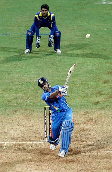 Indian cricket captain Mahendra Singh Dhoni hitting the winning six in the World Cup final