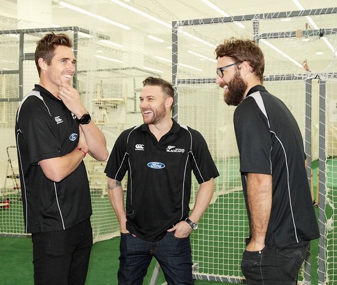 Captain Brendon McCallum, centre, talks with team-mates