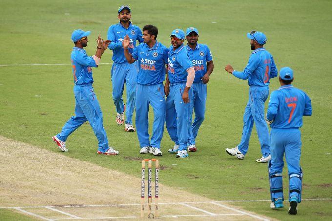 Indian players celebrate after picking up a wicket