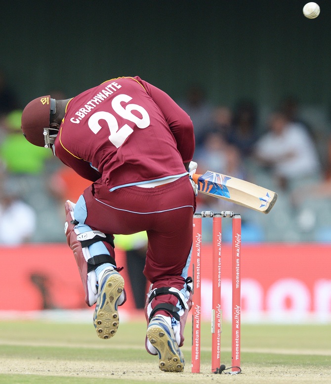 Carlos Brathwaite of West Indies ducks under a bouncer