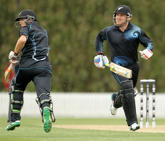 Brendon McCullum, right, and Tom Latham, left, both of New Zealand run between the wickets 