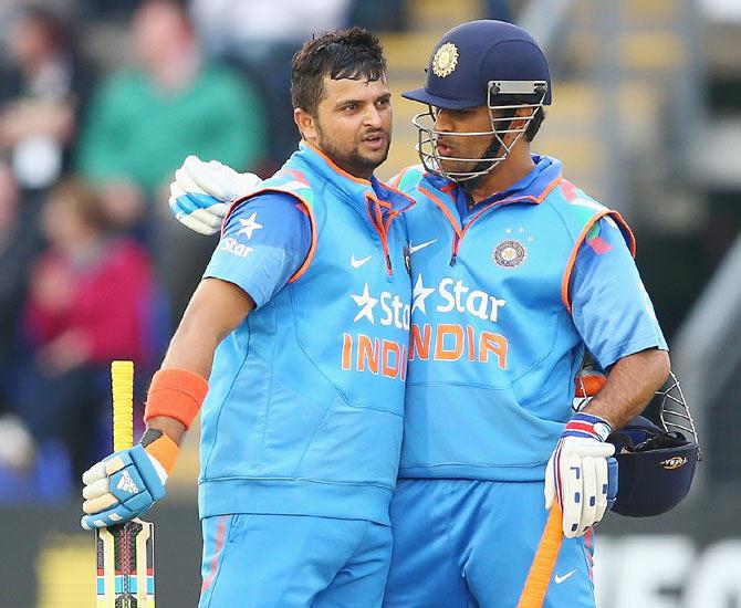 Suresh Raina (left) of India with capatin Mahendra Singh Dhoni