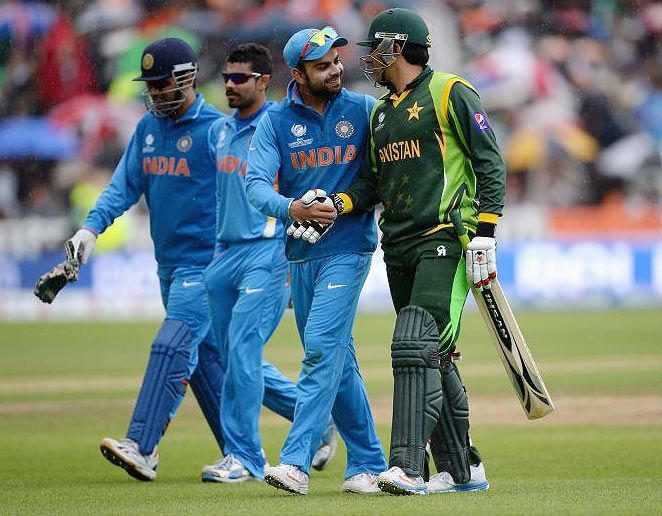 Virat Kohli of India shares a joke with Pakistan captain Misbah-ul-Haq 