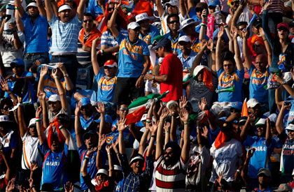Indian cricket fans enjoy themselves during a match