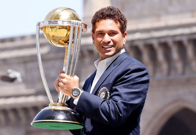 Sachin Tendulkar poses with the ICC Cricket World Cup Trophy, at the Gateway of India at the Taj Palace Hotel, in Mumbai on April 2, 2011