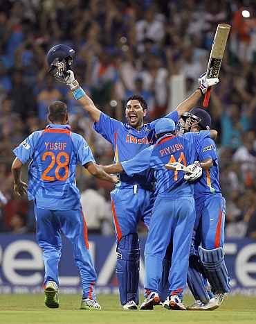 India's Yuvraj Singh celebrates with teammates after winning the World Cup against Sri Lanka in Mumbai