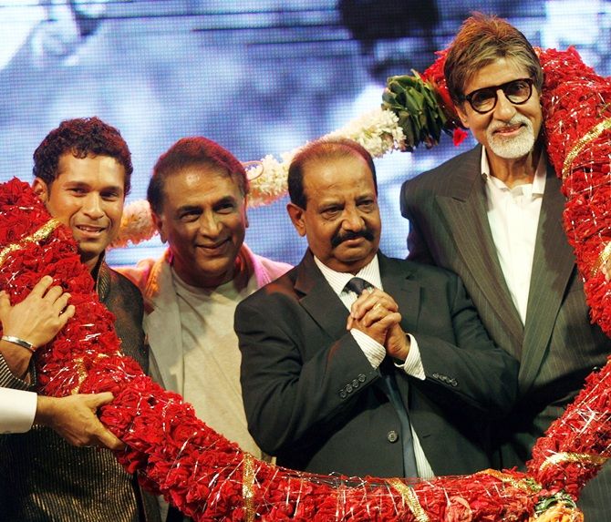 Bollywood actor Amitabh Bachchan, right, former Indian cricketers Sachin Tendulkar, left, Sunil Gavaskar, second left, with Gundappa Viswanath