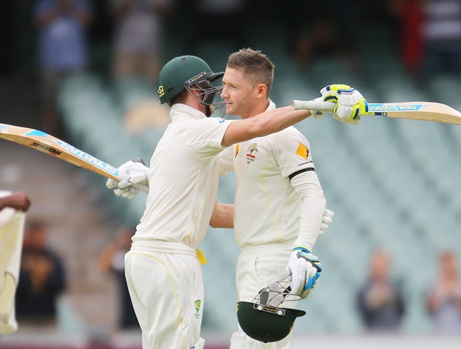 Australia captain Michael Clarke is congratulated by Steven Smith 