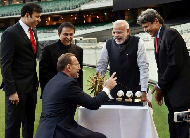 V V S Laxman, Sunil Gavaskar, Prime Minister Narendra Modi, Kapil Dev and then Australian PM Tony Abbott. Photograph: PTI