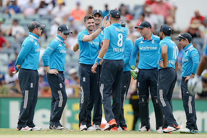 James Anderson of England celebrates with teammates after dismissing Mahendra Singh Dhoni of India during the One Day International match 