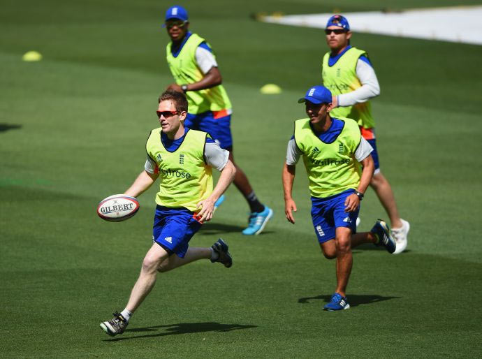 England captain Eoin Morgan runs with the ball in a game of touch rugby during an England nets session at Melbourne Cricket Ground