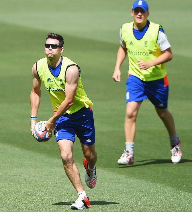 James Anderson of England runs with the ball in a game of rugby during an England nets   session