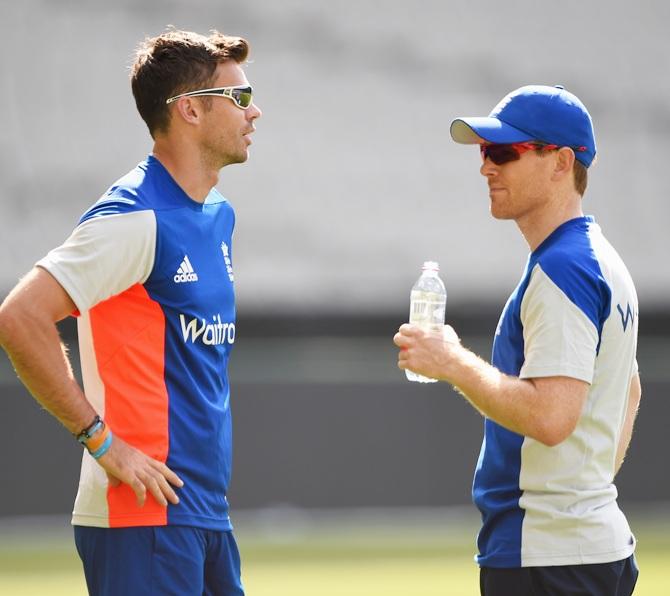 James Anderson of England talks with captain Eoin Morgan