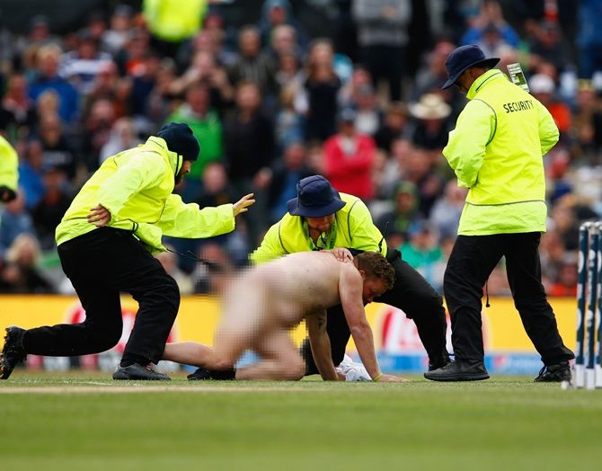 A pitch invader runs onto the field during the 2015 ICC Cricket World Cup match between Sri Lanka and New Zealand at Hagley Oval 