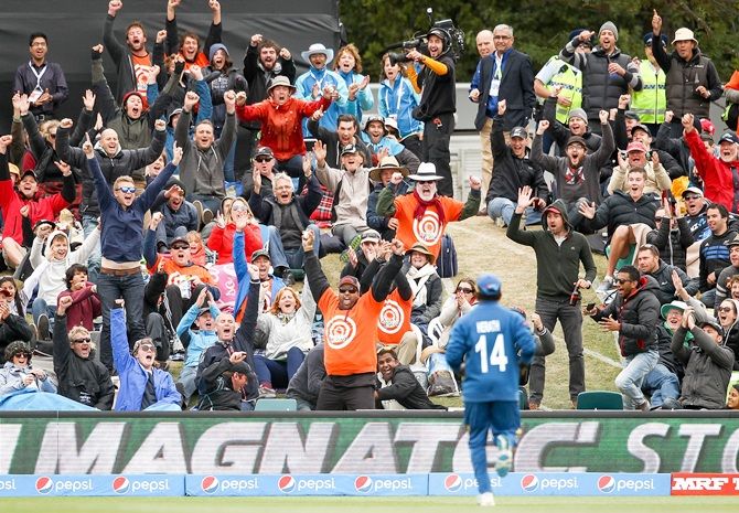 A spectator, centre, holds a one handed catch to win $1000,000 during the 2015 ICC Cricket World Cup match between Sri Lanka and New Zealand at Hagley Oval