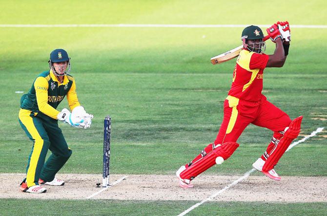 Hamilton Masakadza of Zimbabwe works the ball away for four runs