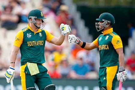 South Africa's JP Duminy (right) and David Miller celebrate during their world record partnership in the World Cup match against Zimbabwe at Seddon Park, Hamilton, New Zealand.