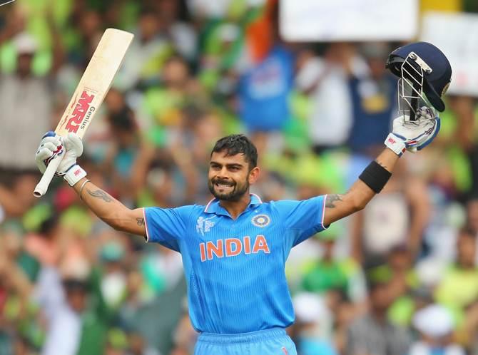 Virat Kohli celebrates his century. Photograph: Scott Barbour/Getty Images