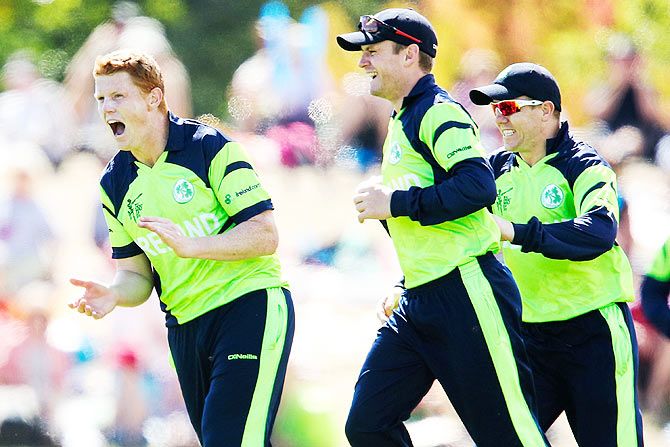 Kevin O'Brien, William Porterfield and Niall O'Brien of Ireland celebrate the wicket of Darren Bravo of the West Indies during their 2015 ICC Cricket World Cup match at Saxton Field in Nelson, New Zealand, on Monday