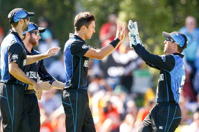 Trent Boult (cenre) of New Zealand celebrates