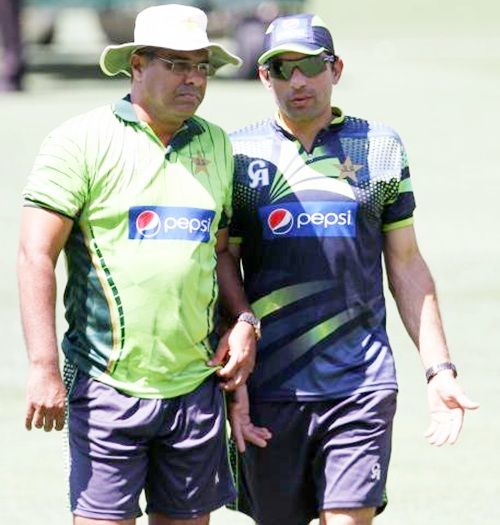 Pakistan captain Misbah Ul Haq speaks coach Waqar Younis during the practice session
