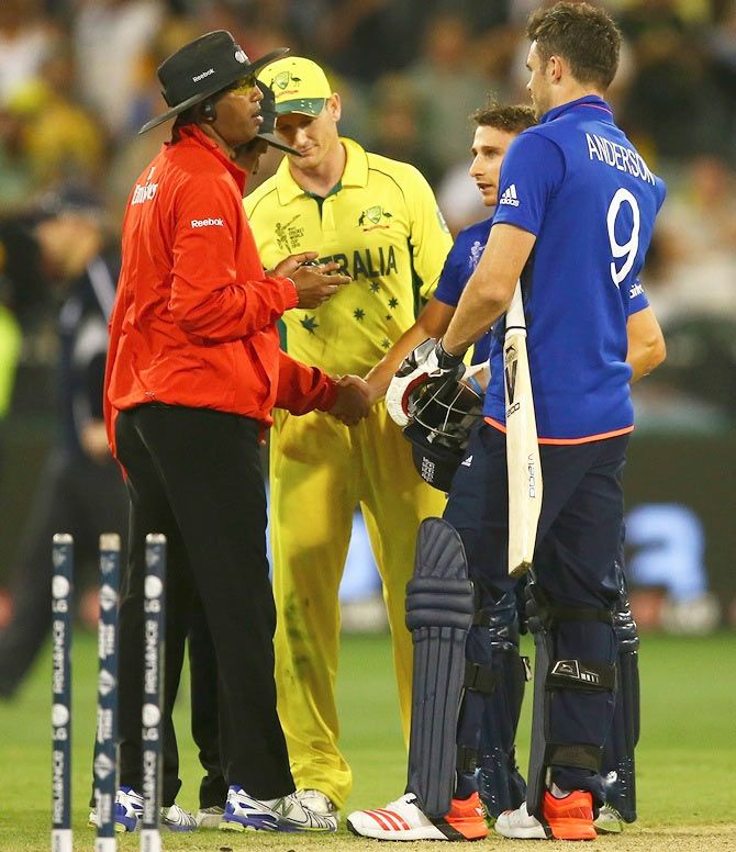 James Taylor and James Anderson of England speak to umpire Kumar Dharmasena after their final wicket fell