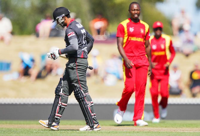 United Arab Emirates opener Amjad Ali leaves the field after being dismissed by Tendai Chatara