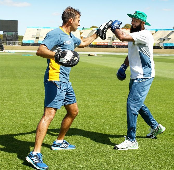 Hashim Amla, right, boxes with fitness trainer Gregory King