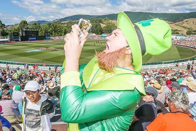 An Ireland fan poses with the replica of the World Cup as he shows his support during the match between the West Indies and Ireland at Saxton Field in Nelson, New Zealand, on February 16