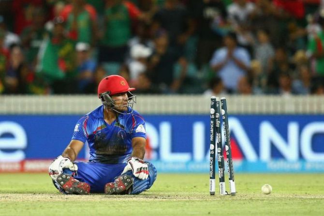 Samiullah Shinwari of Afghanistan wears a dejected look after being run-out during the World Cup match against Bangladesh on Wednesday