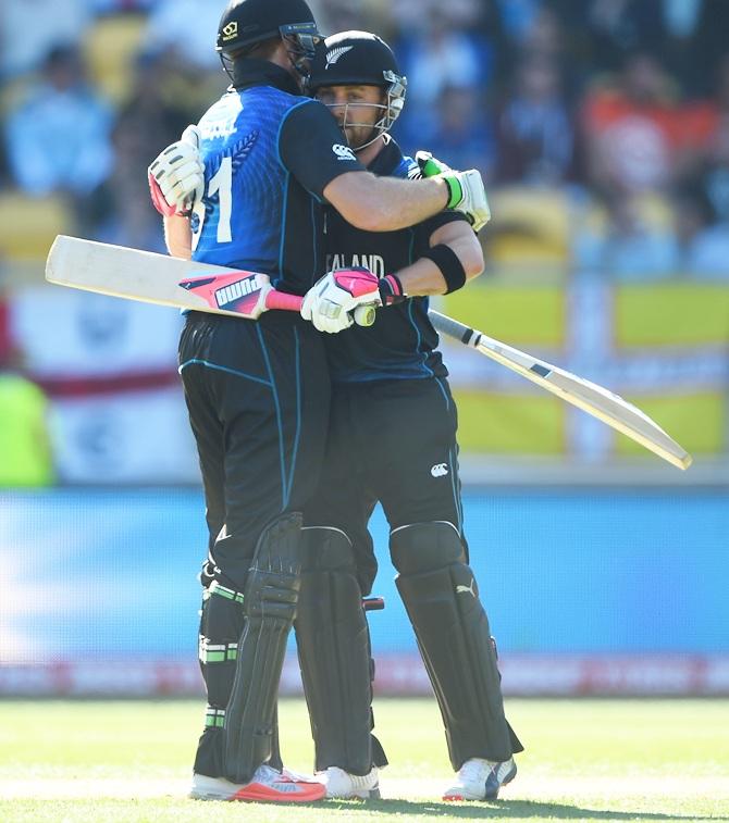 New Zealand captain Brendon McCullum embraces teammate Martin Guptil